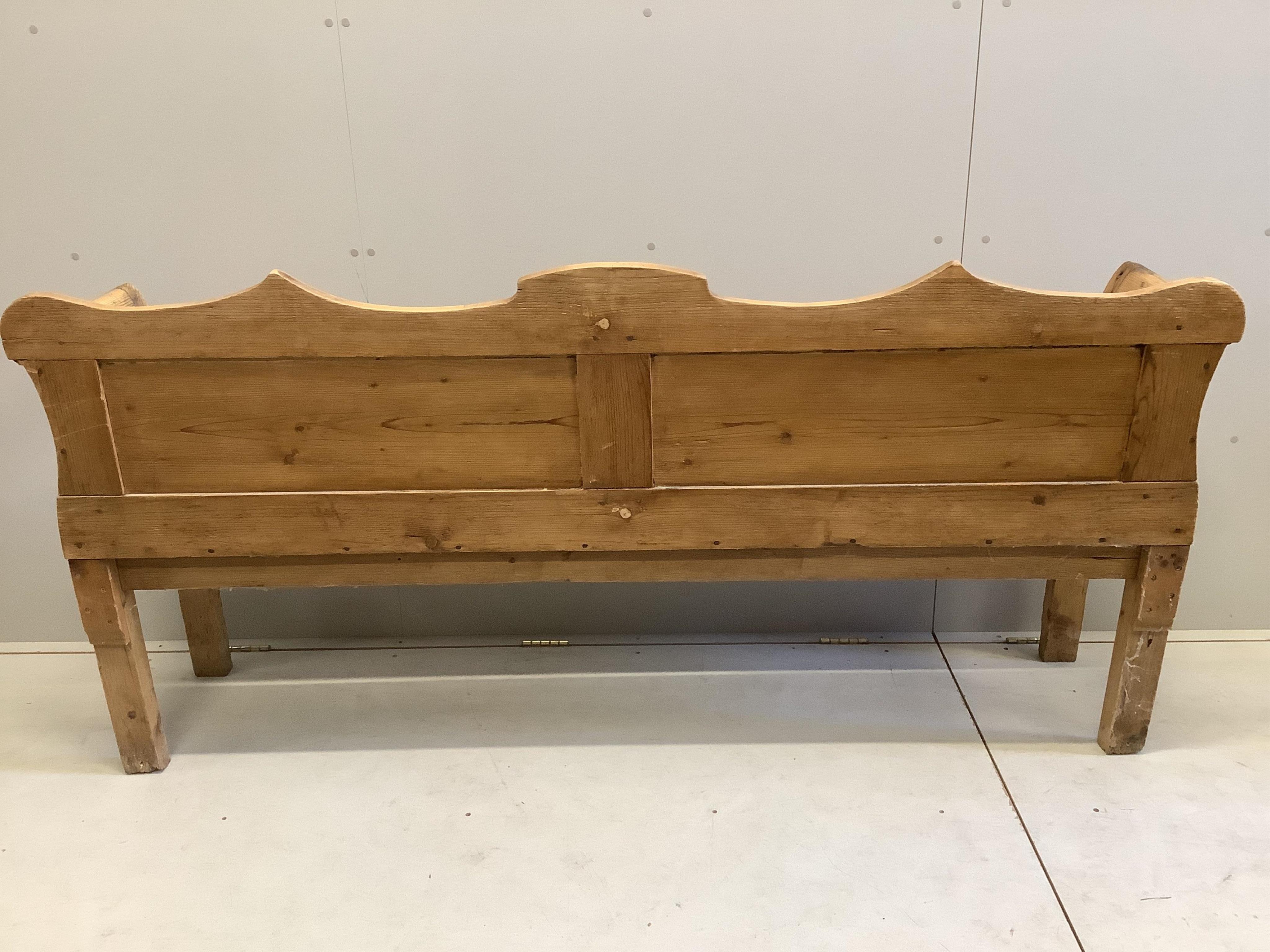 A 19th century pine settle, width 196cm, depth 44cm, height 97cm